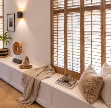 Wooden shades filtering strong afternoon sunlight in a Mediterranean room