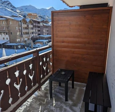 Private balcony at a Val Thorens ski apartment with mountain and resort views