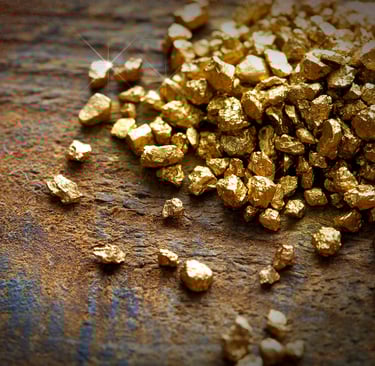 a pile of gold nuggling on a table