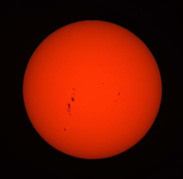 the sun morning of the 12/7/25, the dark spots are called sun spots they are cooler than the sun