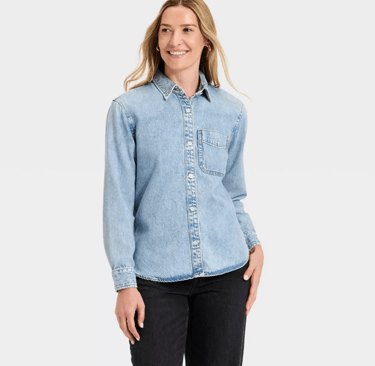 woman wearing a light wash long sleeve denim button-down shirt from target universal thread