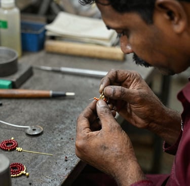 Artisan’s hands carefully polishing a bracelet, highlighting the dedication behind every piece