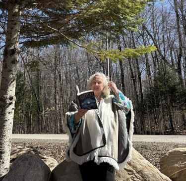 Tammie Whalen Buckler holding book, "Echoes Between Realms"