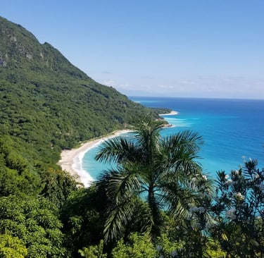 Tropical coastline and lush green mountains in Barahona, Dominican Republic