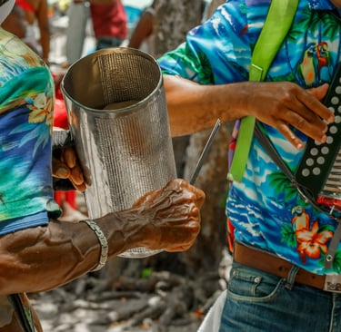 Musicians playing güira and accordion in the Dominican Republic