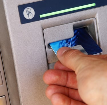 Person withdrawing money from an ATM in the Dominican Republic
