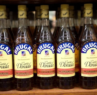 Brugal Carta Dorada Dominican rum bottles displayed on a local store shelf