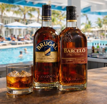 Brugal and Barceló Dominican rum bottles with glass of rum by Punta Cana resort pool