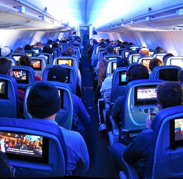 a group of passengers sitting in a plane