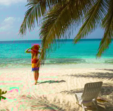 a woman with a red hat on a beach in the dominican republic