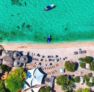Aerial view of a beachfront glamping eco-lodge in Cabo Rojo, Pedernales