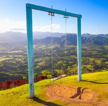 Scenic swing at Montaña Redonda overlooking lush valleys near Los Haitises, Dominican Republic