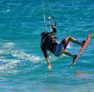 Man kitesurfing over turquoise water in the Dominican Republic