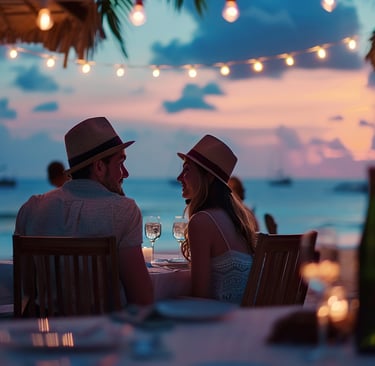 Romantic beachfront dinner in the Dominican Republic with wine, candlelight, and Caribbean sunset views