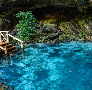 Hoyo Azul cenote with crystal blue water at Scape Park Punta Cana Dominican Republic