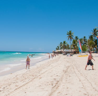 Punta Cana Bávaro Beach with white sand, turquoise water, palm trees, and beach activities