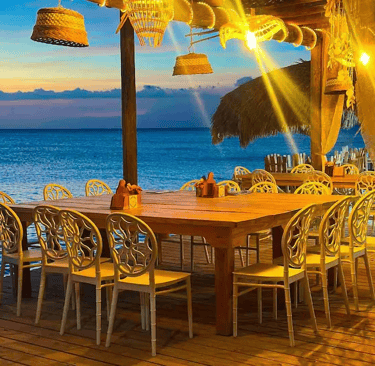 Open-air oceanfront restaurant at sunset in Cabo Rojo, Pedernales, Dominican Republic
