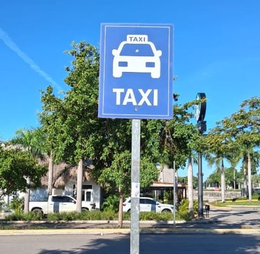 Taxi stand sign on a sunny street in the Dominican Republic