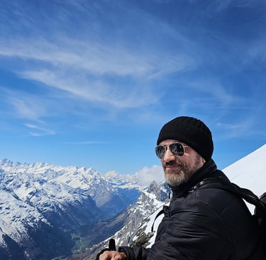 a man with a backpack on a mountain