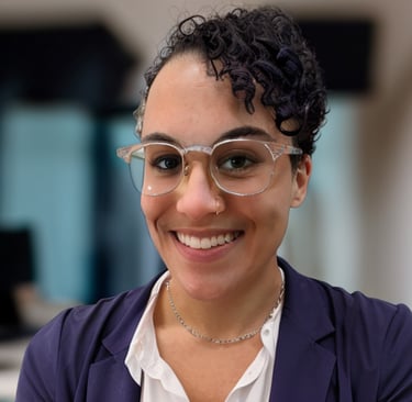 a woman in glasses and a white shirt
