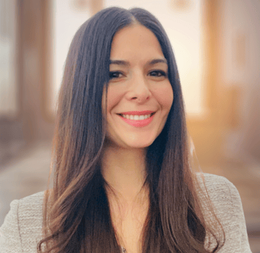 a woman with long hair and a necklace