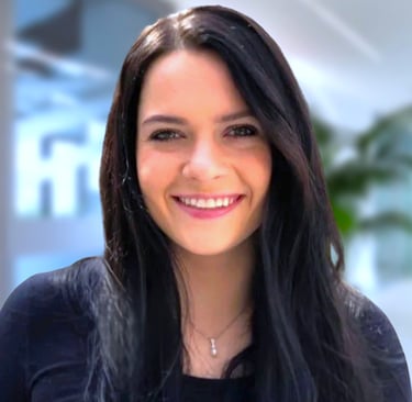 a woman with long hair and a black top
