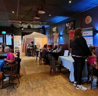 a group of people sitting at tables in a room