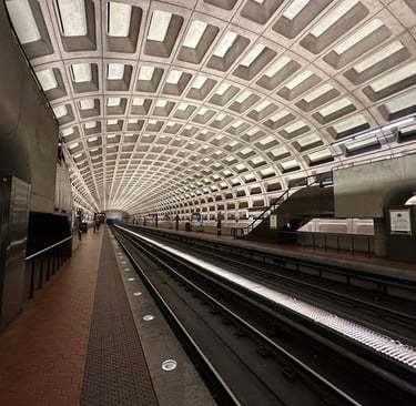 A Washington metro subway station, featuring a concrete grid pattern on the ceiling