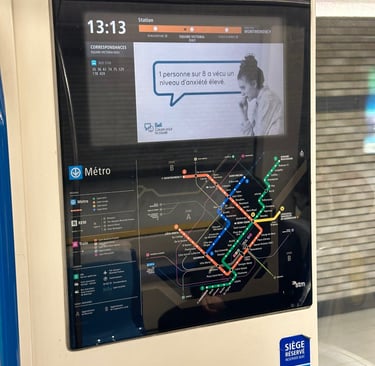 A digital screen on the Montreal Metro showing the system map and current location