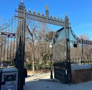 wrought-iron gates at the entrance to Retiro Park