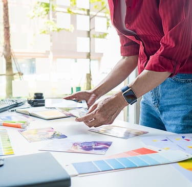 a person standing in front of a computer screen