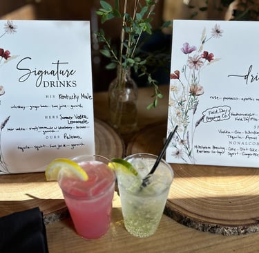 a table with a drink and a menu