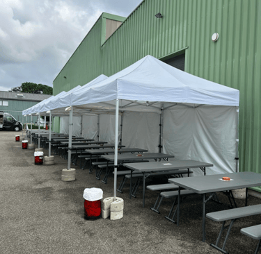 a group of tables and chairs in a parking lot