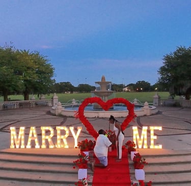 a couple engagement marry me big letters