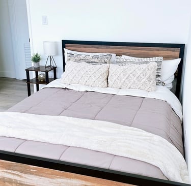 a bed with a wooden bed frame and a wooden bed