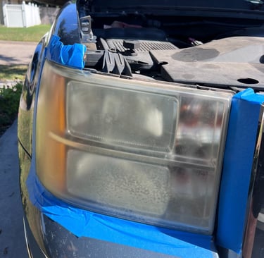 Front of blue truck has faded and hazed headlight, the restoration has not yet taken place