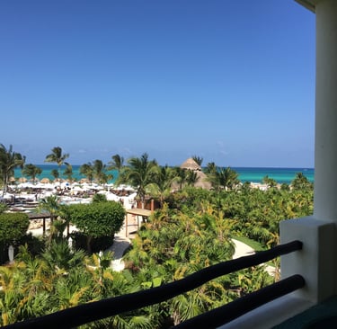 a balcony with a view of the ocean