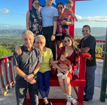 a family in a big decorative puerto rico shair