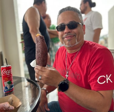 a man eating an puerto rican alcapuria