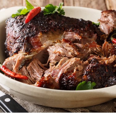 a plate of roasted pork, puerto rican pernil