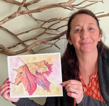 Artist holding Maple leaf finished painting
