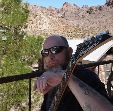 RH McClurg On Set in Ghost Town of Nelson Nevada with Guitar