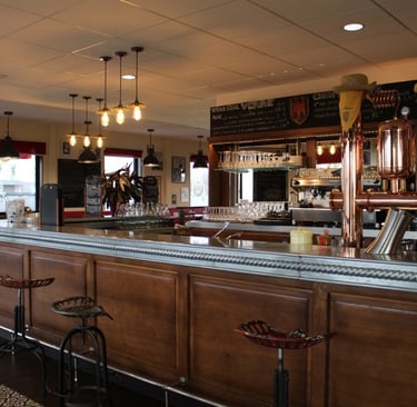 a bar with a bar stool and bar stools