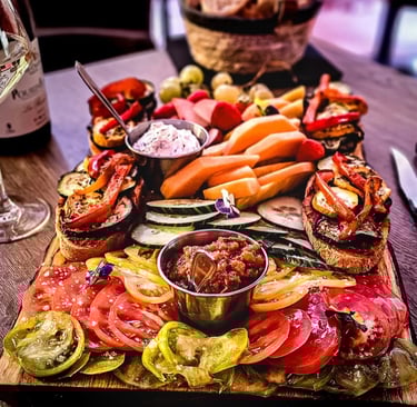 a platter of food and wine glasses