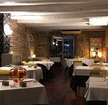 a restaurant with tables and chairs and a table