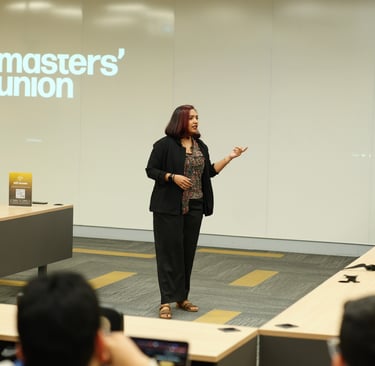 Eila Qureshi taking an in person workshop on building MVP using AI and no code tools