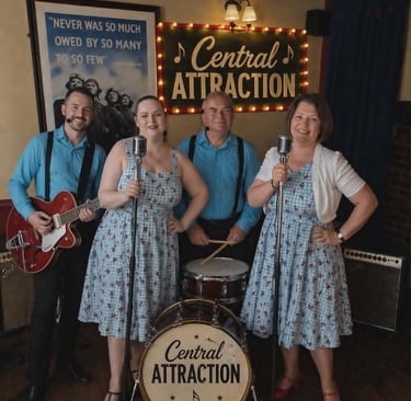 Central Attraction 1940s vintage band performing with 50s rock and roll style attire and instruments.