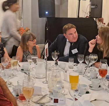 an actor in character being grilled by guests