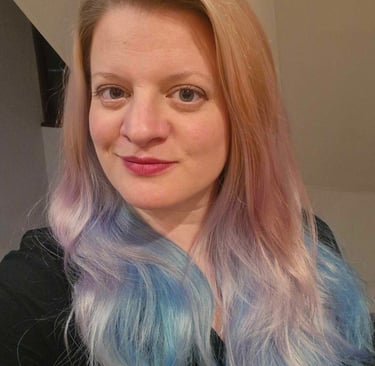 a woman with a blue and white hair and a black shirt