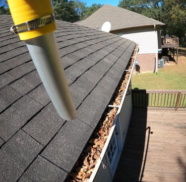 Residential gutter cleaning with a gutter vac